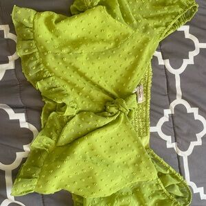 cropped green top with puffy sleeves